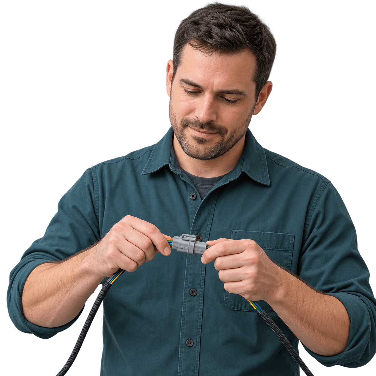 Engineer joining a gray connector pair between two wiring harness leads